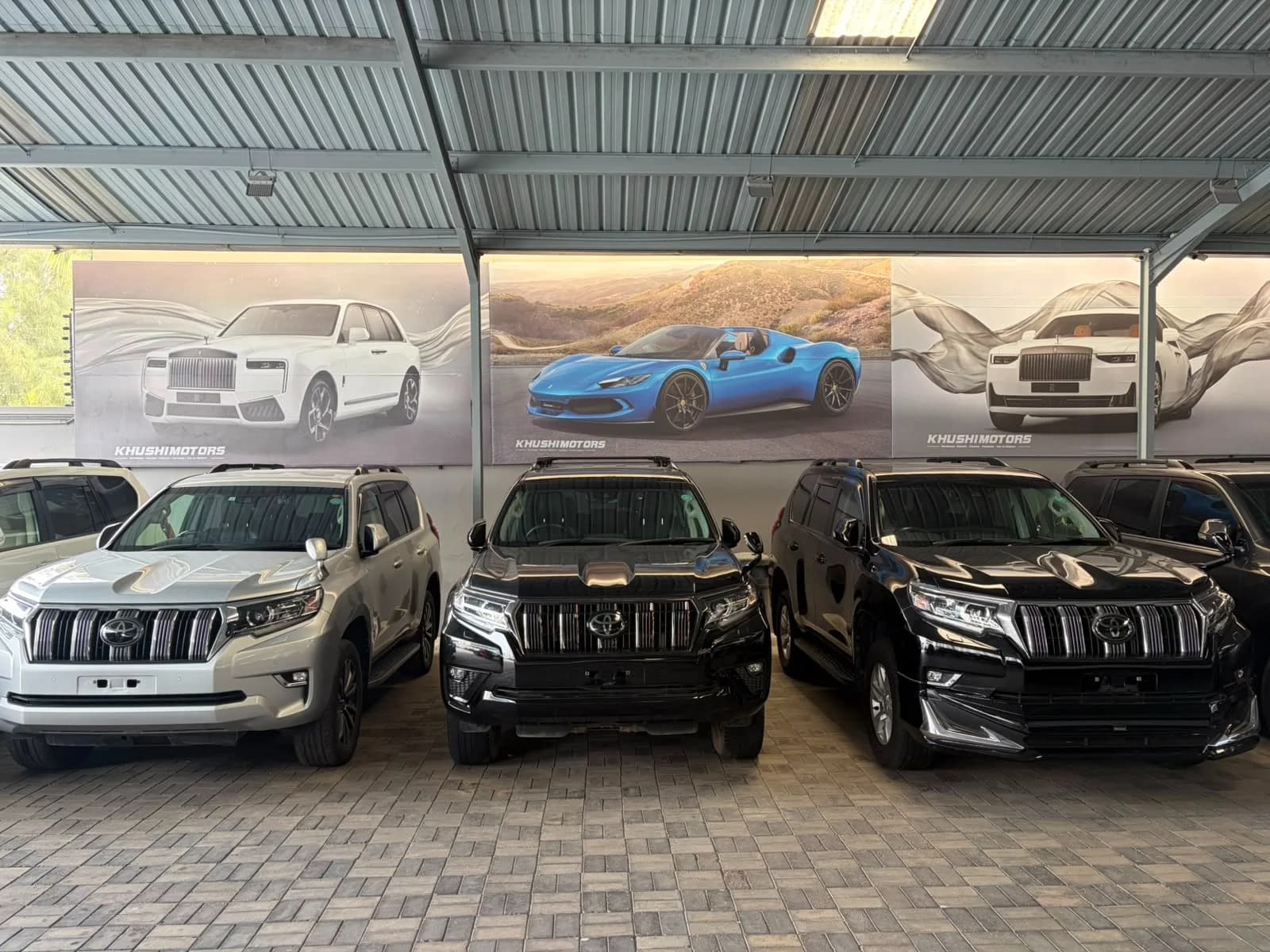 Khushi Motors Mombasa showroom exterior with used Japanese cars on display in Kenya