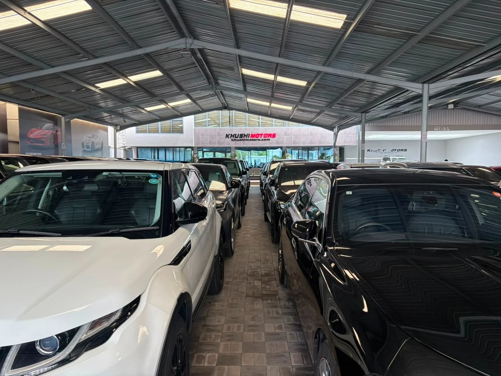 Inside the Khushi Motors Kenya showroom — customer viewing area and vehicle display in Mombasa