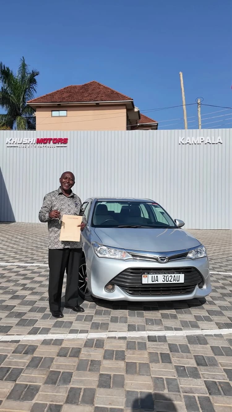 Happy vehicle owner at Khushi Motors Kampala showroom