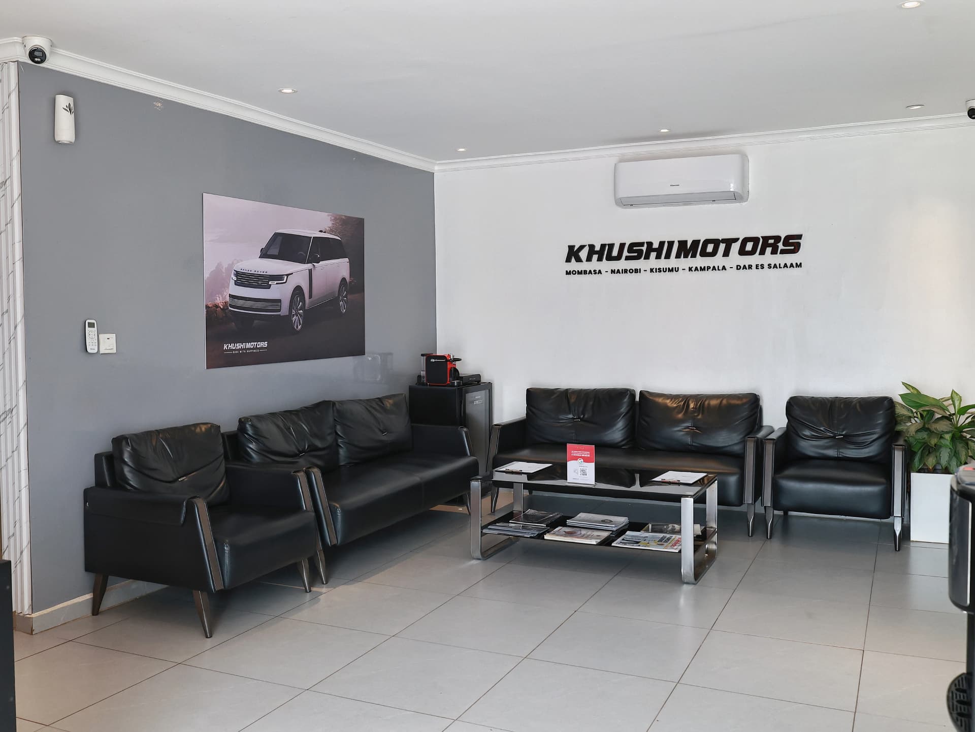 Customer viewing area for inspecting used cars at Khushi Motors Kampala