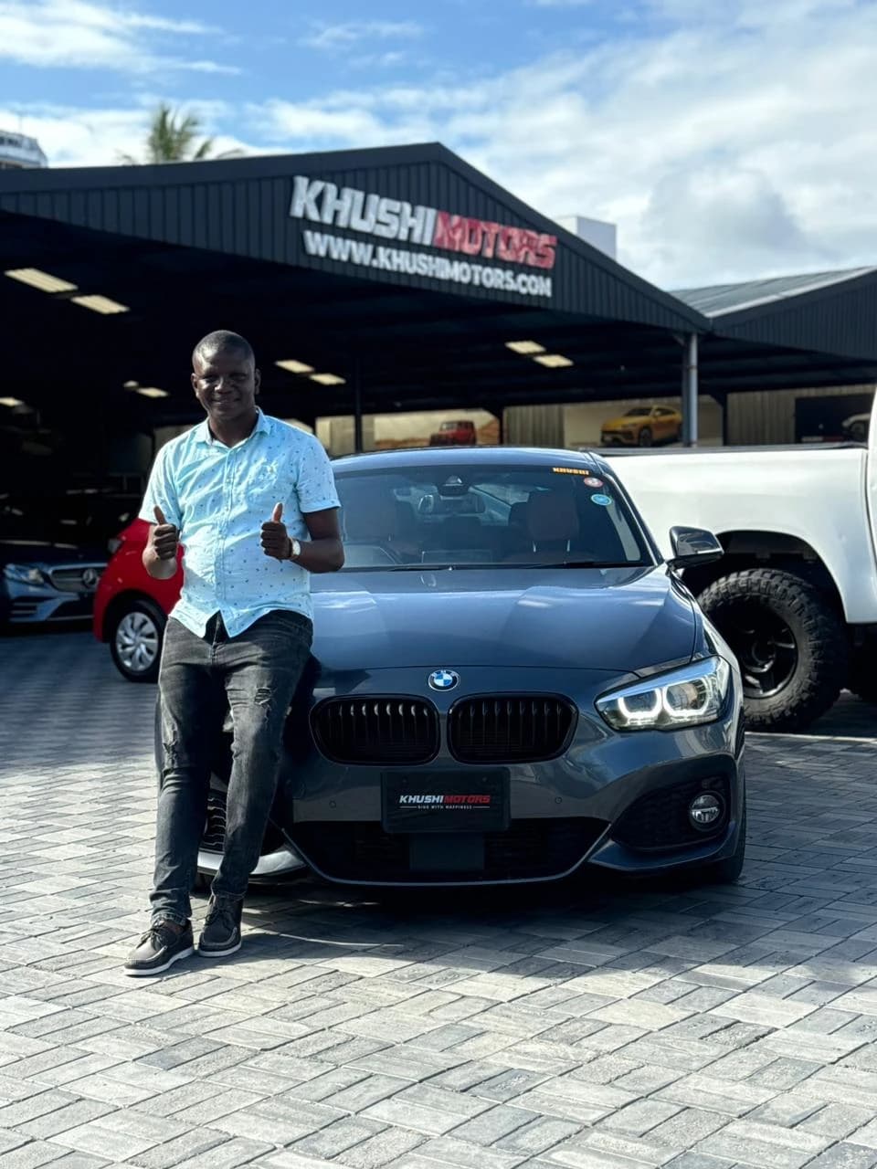 Customer collecting keys at Khushi Motors Kenya showroom