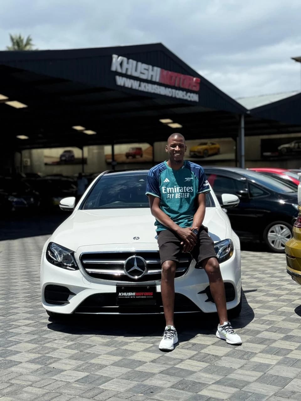 Happy vehicle owner collecting car in Kenya