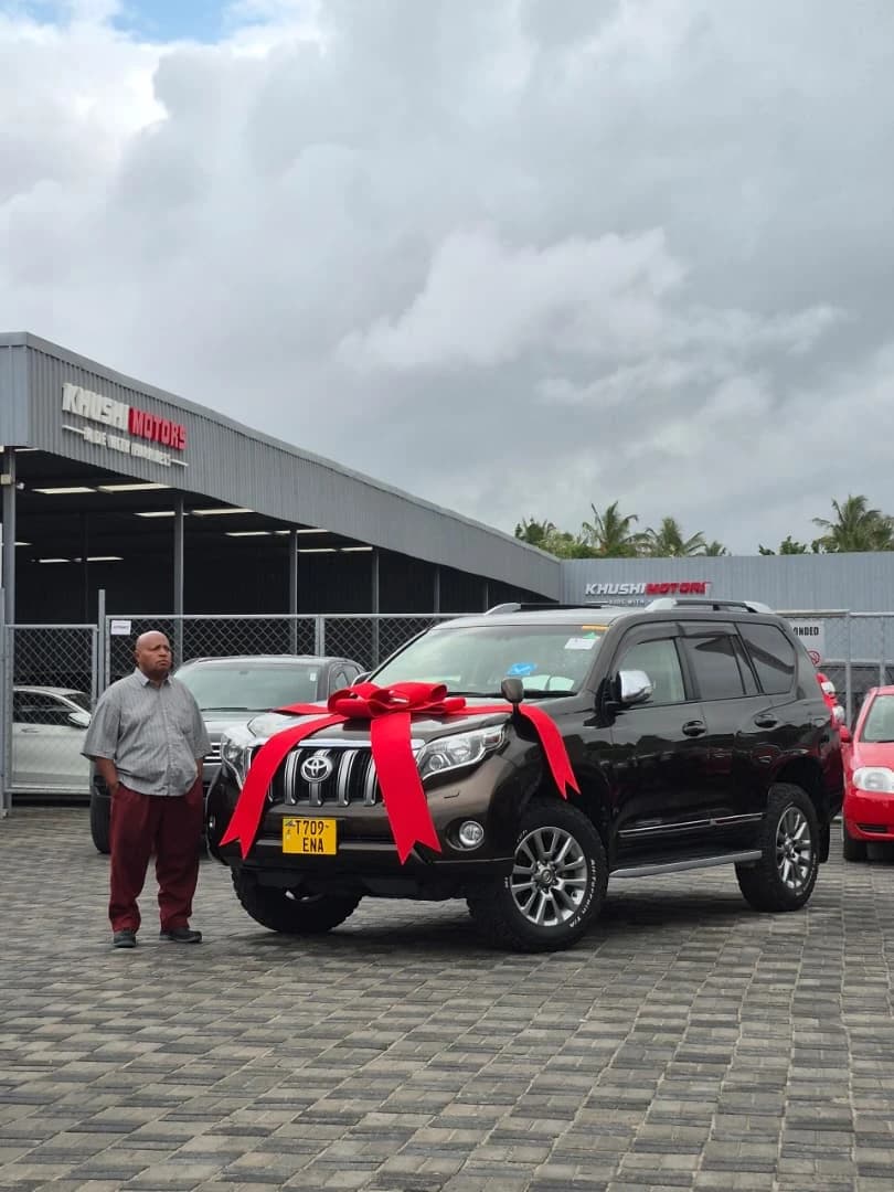 Customer receiving vehicle keys in Dar es Salaam Tanzania